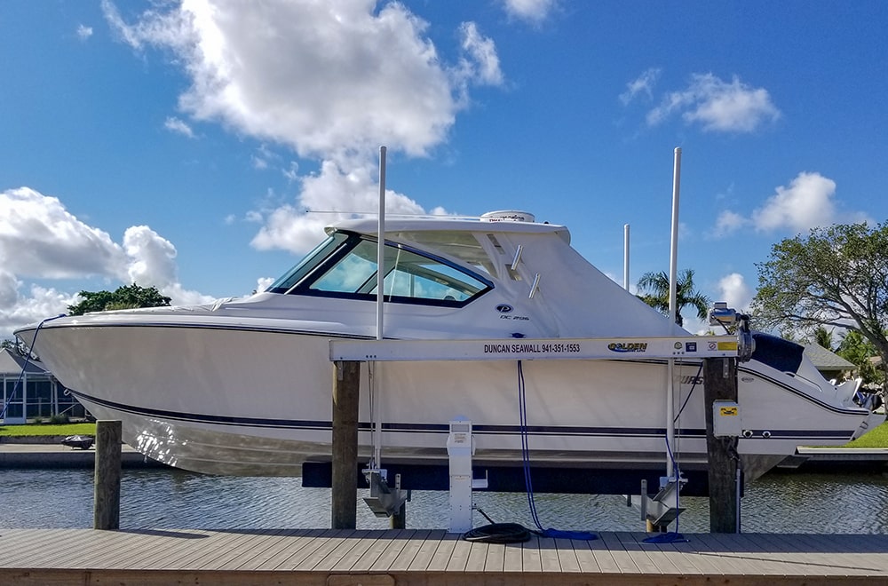 boat lift and boat blue sky sarasota florida