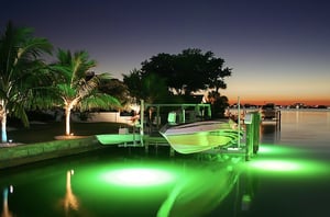 marine electrical lights in water by dock and boat and seawall