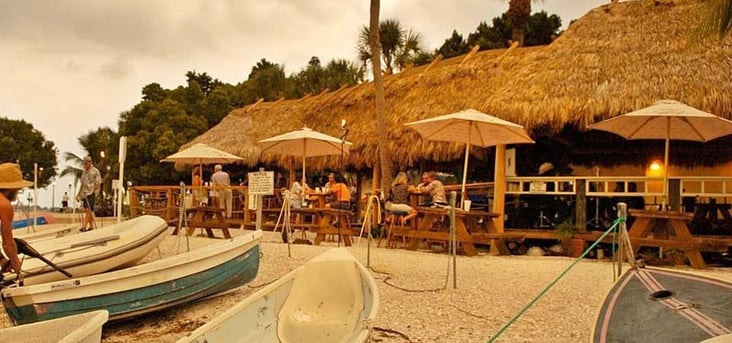 O’Leary’s Tiki Bar waterfront restaurant in Sarasota with outdoor seating.