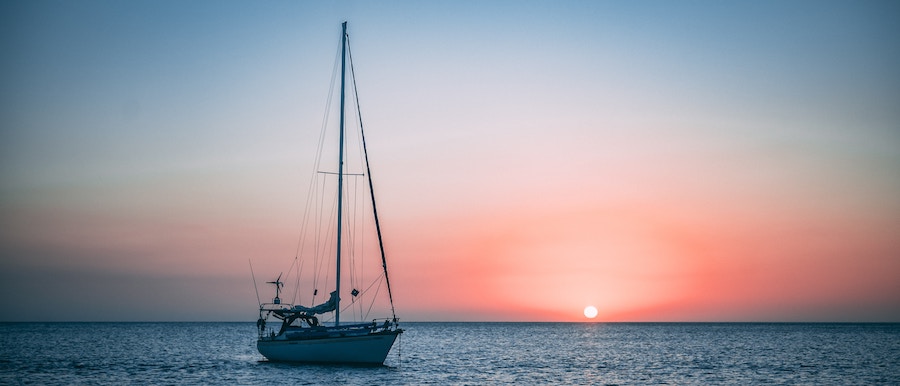 sailboat on the water during sunset